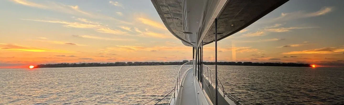 Sunset reflection in window of a yacht
